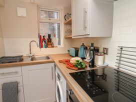 A kitchen with a sink and appliances at Farriers Yard in Whitby