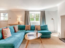 A living room with a sofa and coffee table at Summerleaze Cottage 2 Spa Bude