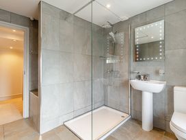 A bathroom with a shower, toilet and sink at Summerleaze Cottage 2 Spa Bude