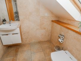 A bathroom with a sink and toilet at Oak Tree Cottage, Oldwalls, Llanrhidian, Gower