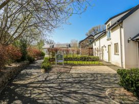 An outdoor area with a pathway and garden at Oak Tree Cottage in Oldwalls, Llanrhidian, Gower