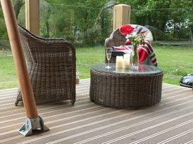 A seating area with chairs and a table at Ceri Newcastle Emlyn