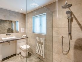 A bathroom with a sink, toilet and shower at Tranquillity 3 in Warton near Carnforth