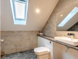 A bathroom with a toilet and sink at Tranquillity 3 Warton near Carnforth
