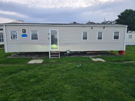 A static caravan with steps and windows at Brynowen Holiday Park - Holiday Accommodation 22432 in Borth