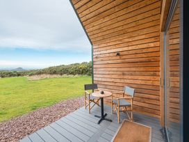 An outdoor patio with a table and chairs at The Weir in North Berwick