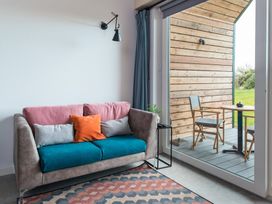 A living room with a sofa and table at The Weir in North Berwick