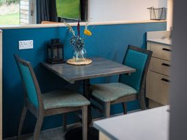 A dining area with a table and chairs at The Weir in North Berwick