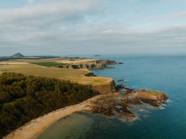 A coastal view with cliffs and water at The Weir in North Berwick