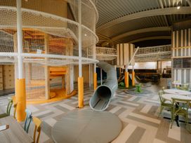 A play area with climbing structure and slide at The Weir in North Berwick