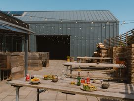 An outdoor dining area with tables and food at The Weir in North Berwick
