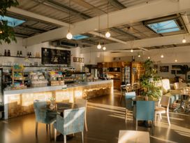 A cafe with a counter and tables at The Weir in North Berwick