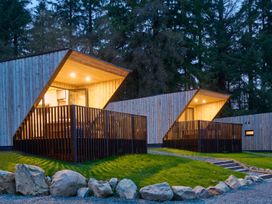 Two modern wooden houses with patios at Orka 1.0 Spa (Pet) Dumfries