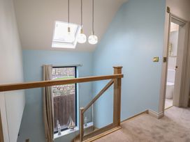 A hallway with a skylight and light fixtures at Pistyll Ddu Brynsiencyn near Llanfairpwllgwyngyll