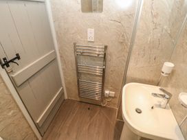 A bathroom with a sink and towel rail at Orchard Cottage in Appleby-in-Westmorland