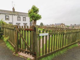 A gate leading to a garden at Orchard Cottage in Appleby-in-Westmorland