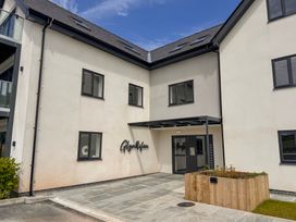 An entrance to a building with a sign at Glynllifon 4 in Marianglas