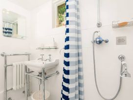 A bathroom with a sink and shower at Ladye Park in Liskeard
