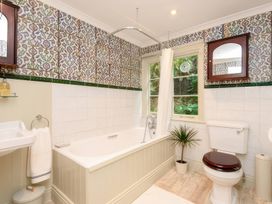 A bathroom with a bathtub and sink at Ladye Park in Liskeard