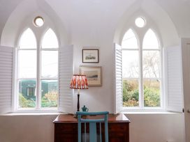 A room with windows and a desk at Old Sunday School in Welcombe near Kilkhampton