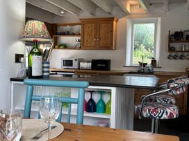 A kitchen with cabinets and countertop at The Old Sunday School in Welcombe