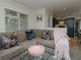 A living room with a sofa and coffee table at Evermore Lodge 48 Calgarth Park, White Cross Bay, Windermere