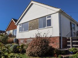 A house with windows and a garden at Woodbury in Teignmouth