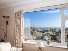 A living room with a view of the sea at Woodbury in Teignmouth
