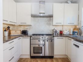 A kitchen with an oven and stove at Woodbury in Teignmouth