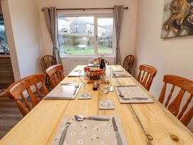 A dining room with a table set for meals at Westerlodge in Threlkeld near Keswick