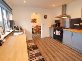 A kitchen with sink and stove at Westerlodge Threlkeld near Keswick