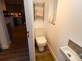 A bathroom with a toilet and sink at Westerlodge Threlkeld near Keswick