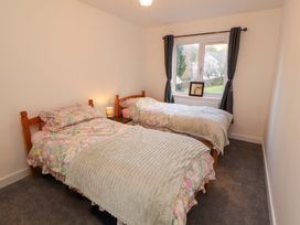 A bedroom with two beds and a window at Westerlodge Threlkeld near Keswick