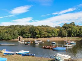 A view of boats on water surrounded by trees at Woodlands View in Leek