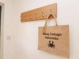Coat hooks and a jute bag at Quay Cottage Salcombe