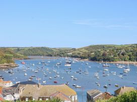 A view of boats in water with hills in the background at Quay cottage Salcombe