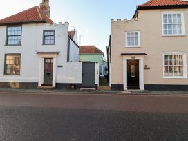 Two houses with doors and windows on a street at Nutshell in Aldeburgh