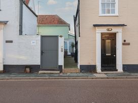 An entrance view of two houses with a gate in Aldeburgh