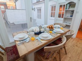 A dining room table set for breakfast at Nutshell in Aldeburgh