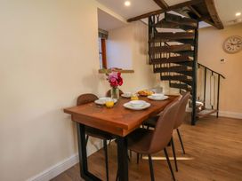 A dining room with a table set for breakfast at Dove Cottage Sneaton near Ruswarp