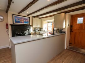 A kitchen with worktop and cooker at Dove Cottage Sneaton near Ruswarp