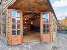 A bar area with a pool table and wooden features at Dove Cottage in Sneaton near Ruswarp