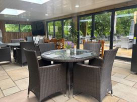 A dining area with tables and chairs at Camnant Newcastle Emlyn
