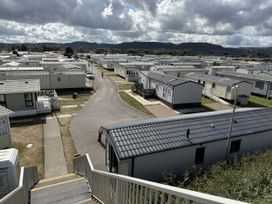 A view of caravans and road at Ty Cariad in Towyn