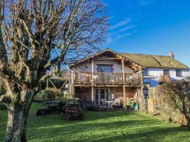 A house with a balcony and garden at The Little Barn Fluxton Nr. Ottery St Mary