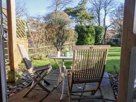 A table and chairs in a garden at The Little Barn Fluxton Nr. Ottery St Mary