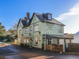 A public house building with a sign at The Little Barn in Fluxton Nr. Ottery St Mary