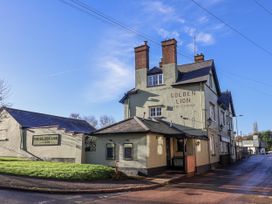 A public house named Golden Lion on a street in Fluxton Nr. Ottery St Mary