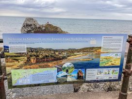 A sign welcoming visitors to Sidmouth on the Jurassic Coast World Heritage Site