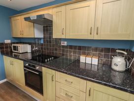 A kitchen with modern appliances at 23 Northumbria Terrace in Amble